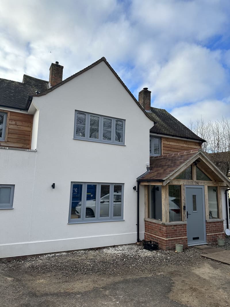 Cottage style oak front porch and front facelift, with render and cladding in Wickham by Signature Design Architecture